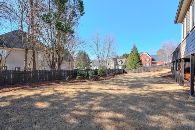 view of yard with a fenced backyard