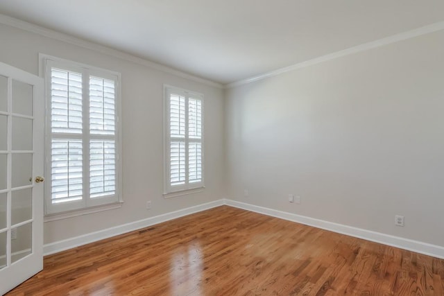 empty room with ornamental molding, visible vents, and plenty of natural light