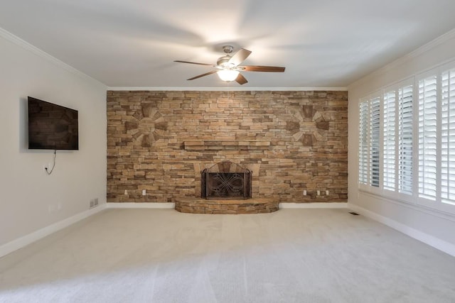 unfurnished living room with ceiling fan, carpet floors, baseboards, and crown molding