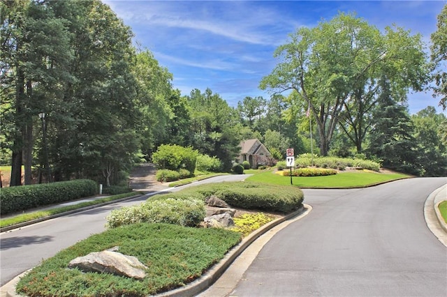515 Old Chartwell Xing, Alpharetta, GA 30022 - view of community featuring view of scattered trees and curved driveway