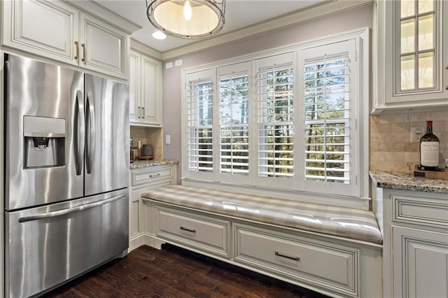 kitchen with stainless steel refrigerator with ice dispenser, backsplash, dark hardwood / wood-style flooring, and white cabinetry