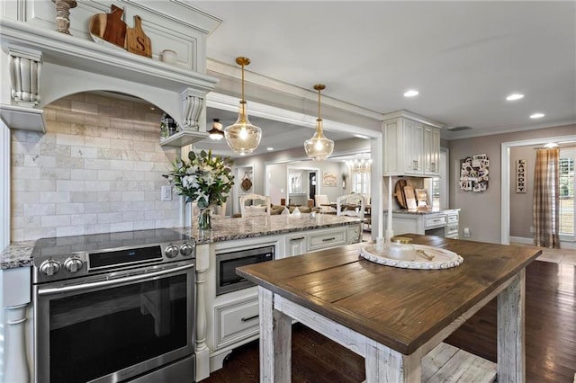 kitchen featuring backsplash, electric range, built in microwave, light stone countertops, and pendant lighting