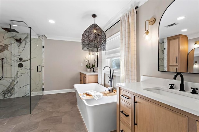 bathroom with vanity, ornamental molding, and independent shower and bath