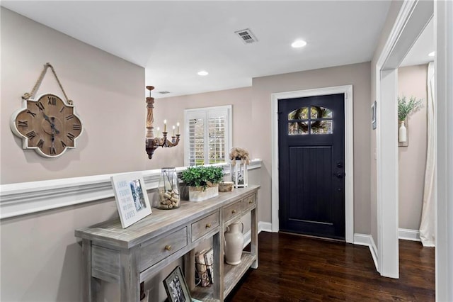 foyer entrance with dark wood-type flooring