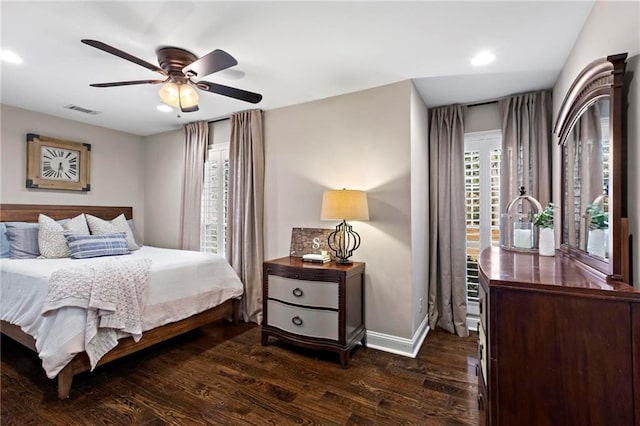 bedroom featuring ceiling fan and dark hardwood / wood-style flooring