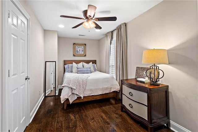 bedroom featuring ceiling fan and dark hardwood / wood-style floors