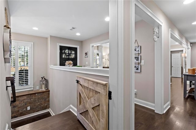 hallway featuring dark wood-type flooring