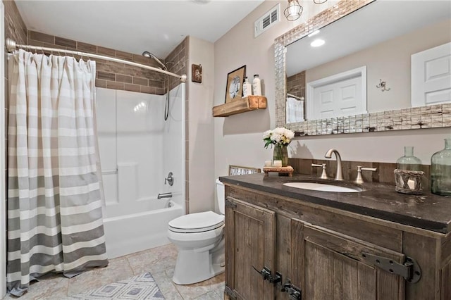 full bathroom with shower / bath combo with shower curtain, toilet, and vanity