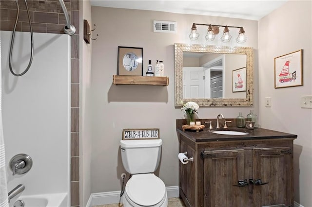 full bathroom featuring toilet, vanity, and tub / shower combination