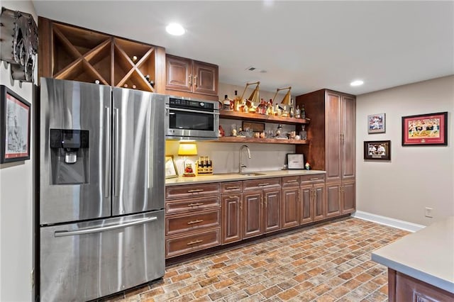 kitchen with appliances with stainless steel finishes and sink