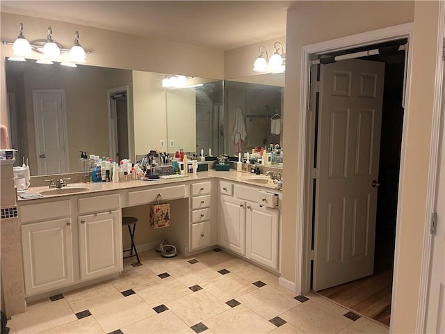 full bathroom with vanity and a stall shower