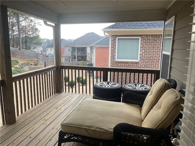 wooden terrace featuring a residential view