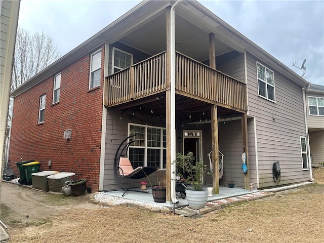 rear view of property featuring a patio area