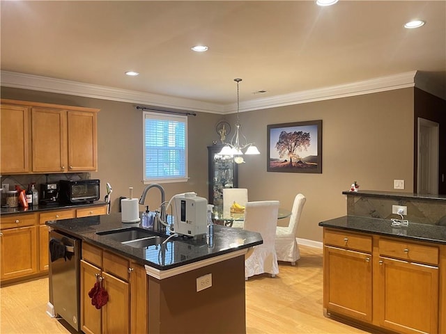 kitchen featuring light wood-type flooring, brown cabinets, decorative backsplash, a sink, and dishwashing machine