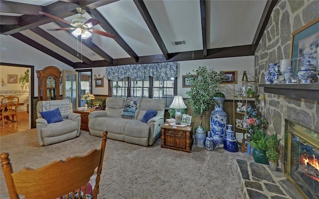 living room featuring a stone fireplace, vaulted ceiling with beams, ceiling fan, and visible vents