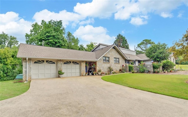 view of front of property with stone siding, a front yard, concrete driveway, and an attached garage