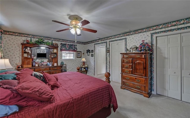 bedroom featuring carpet floors, ceiling fan, and wallpapered walls