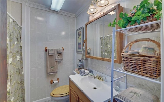 bathroom with vanity, ornamental molding, curtained shower, and tile walls