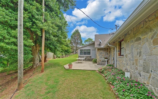 view of yard with fence and a patio area