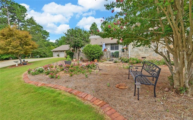 view of front of property featuring stone siding, a garage, stucco siding, and a front lawn