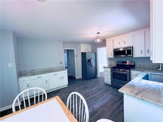 3460 Ebenezer Rd, Marietta, GA 30066 - kitchen featuring appliances with stainless steel finishes, white cabinetry, and dark wood-type flooring
