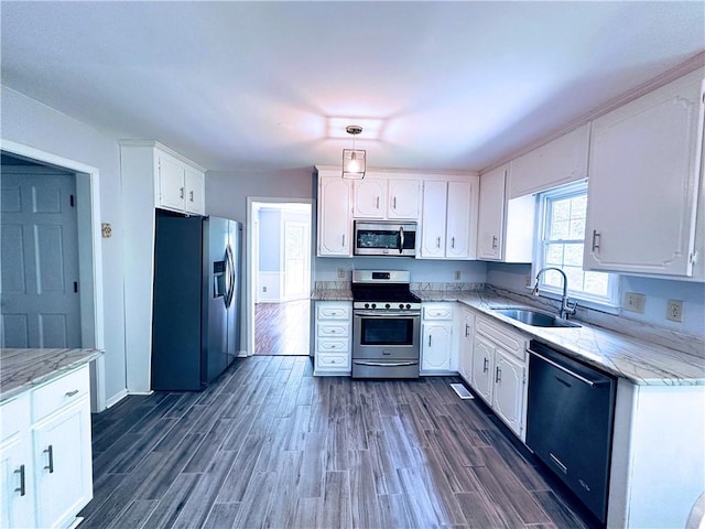 3460 Ebenezer Rd, Marietta, GA 30066 - kitchen featuring stainless steel appliances, white cabinetry, and dark wood finished floors