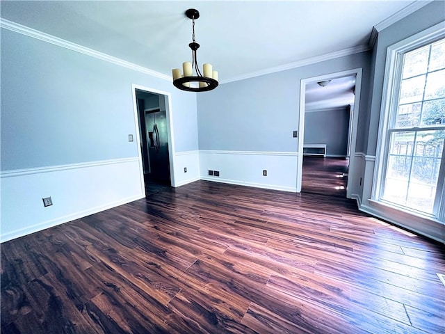 3460 Ebenezer Rd, Marietta, GA 30066 - unfurnished dining area featuring healthy amount of natural light, dark wood-style flooring, crown molding, and a chandelier