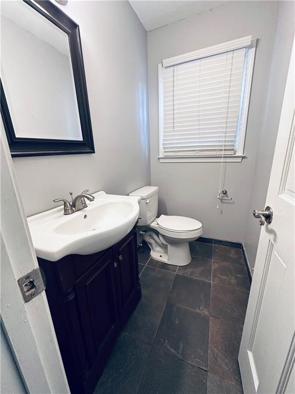 3460 Ebenezer Rd, Marietta, GA 30066 - half bathroom featuring vanity and toilet