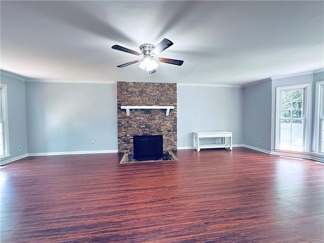 3460 Ebenezer Rd, Marietta, GA 30066 - unfurnished living room with crown molding, ceiling fan, wood finished floors, and a stone fireplace