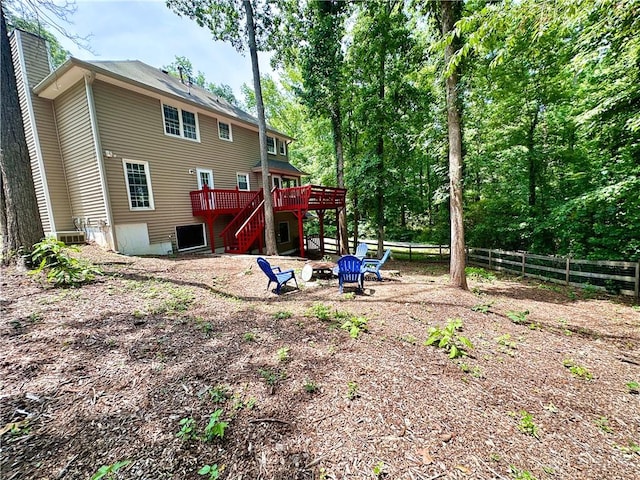3460 Ebenezer Rd, Marietta, GA 30066 - rear view of property with a deck, stairway, a chimney, and an outdoor fire pit