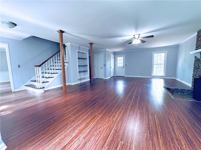 3460 Ebenezer Rd, Marietta, GA 30066 - unfurnished living room featuring ceiling fan, a fireplace, wood finished floors, stairs, and crown molding