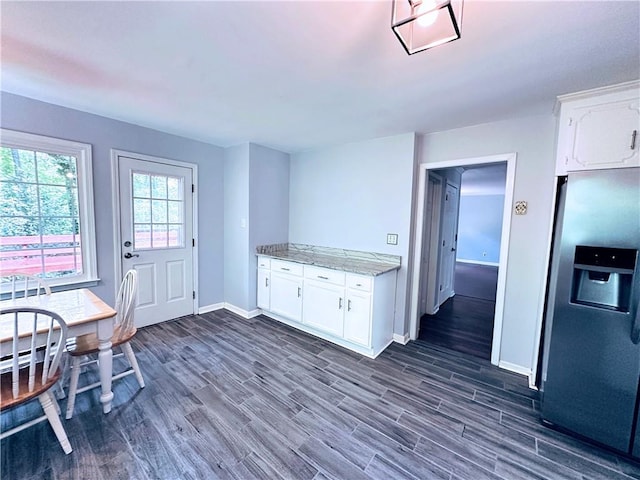 3460 Ebenezer Rd, Marietta, GA 30066 - kitchen featuring stainless steel fridge, dark wood-style flooring, and white cabinetry