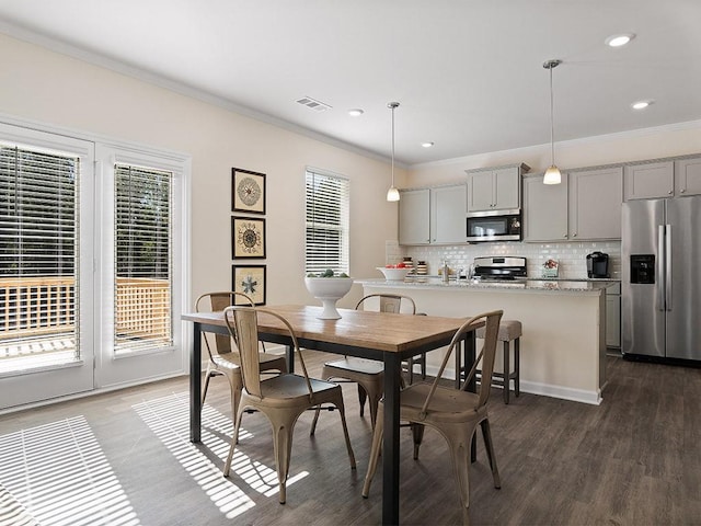 366 Lost Creek Blvd, Dallas, GA 30132 - dining area with healthy amount of natural light, ornamental molding, dark wood-style floors, and recessed lighting
