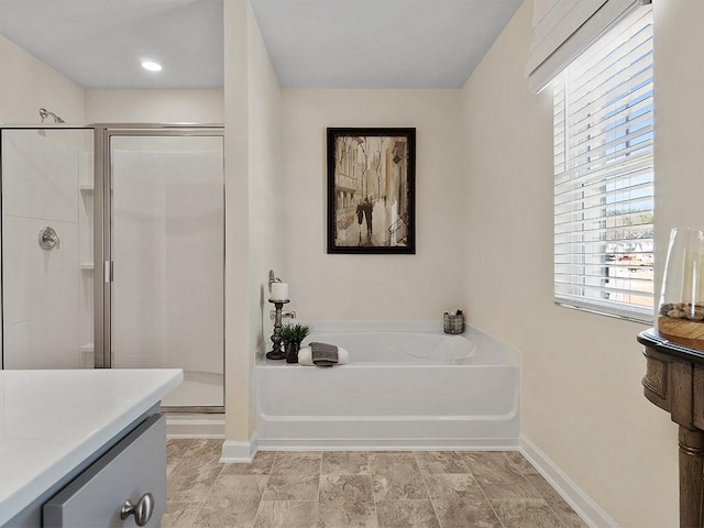 366 Lost Creek Blvd, Dallas, GA 30132 - full bathroom with a garden tub, a stall shower, baseboards, and vanity