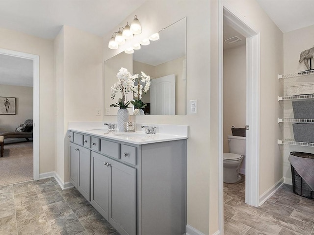 366 Lost Creek Blvd, Dallas, GA 30132 - bathroom with double vanity, toilet, ensuite bath, and baseboards