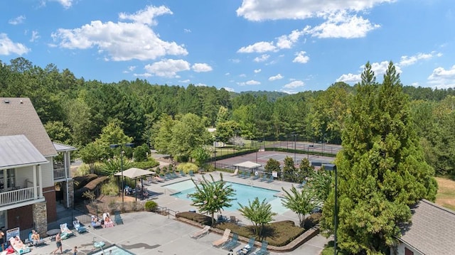 366 Lost Creek Blvd, Dallas, GA 30132 - community pool with a wooded view and a patio area