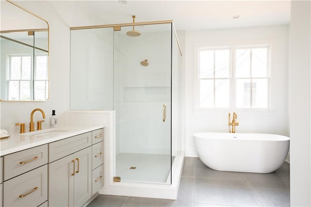 bathroom with vanity, tile patterned floors, shower with separate bathtub, and a healthy amount of sunlight