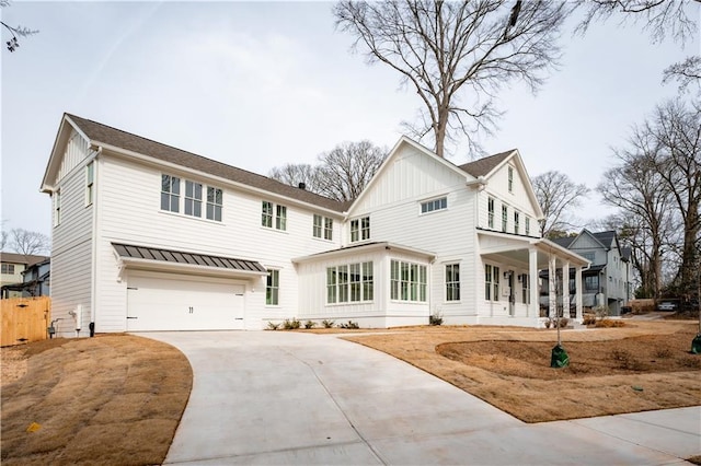 view of front of house featuring a garage and covered porch