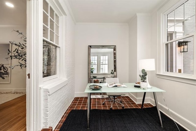 home office with crown molding and baseboards