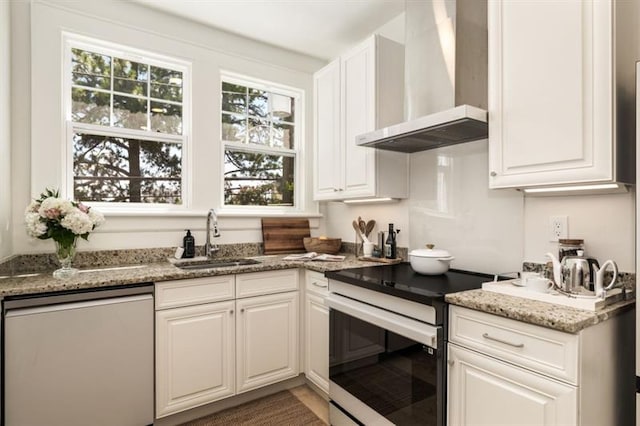 kitchen with white cabinetry, electric range, a sink, dishwasher, and wall chimney range hood