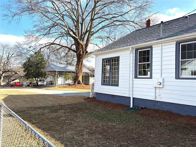 view of property exterior featuring crawl space, a chimney, a shingled roof, and fence