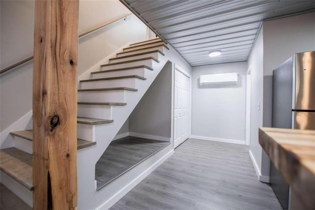 2125 Mccollum Church Rd, Lineville, AL 36266 - stairway with an AC wall unit, baseboards, and wood finished floors
