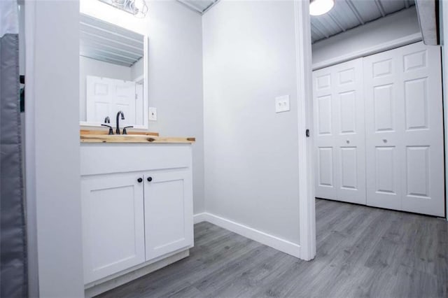 2125 Mccollum Church Rd, Lineville, AL 36266 - bathroom with wood finished floors, vanity, and baseboards