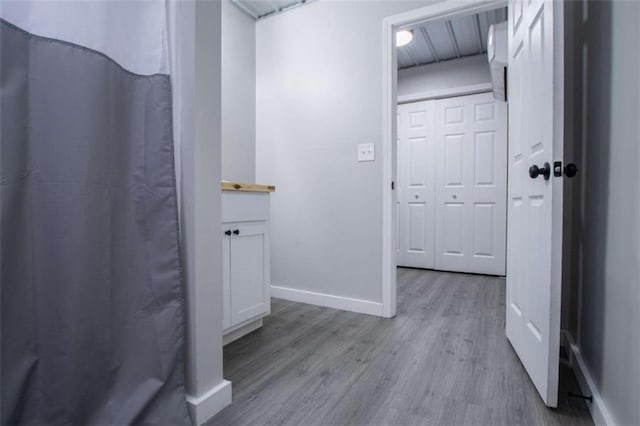 2125 Mccollum Church Rd, Lineville, AL 36266 - full bathroom with wood finished floors, baseboards, vanity, and curtained shower