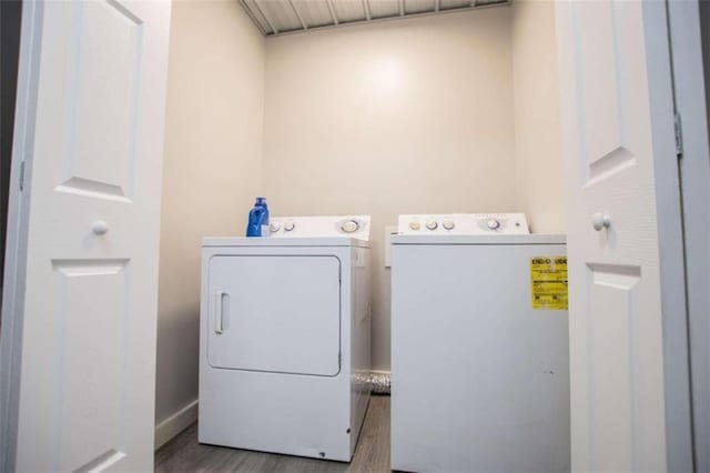 2125 Mccollum Church Rd, Lineville, AL 36266 - washroom featuring washer and clothes dryer and wood finished floors