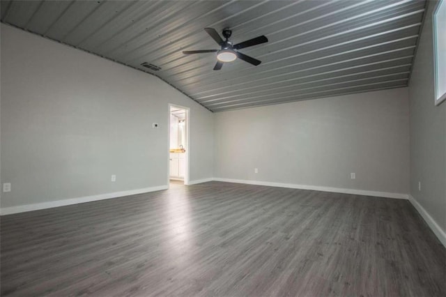 2125 Mccollum Church Rd, Lineville, AL 36266 - spare room featuring vaulted ceiling, dark wood-style flooring, a ceiling fan, and baseboards