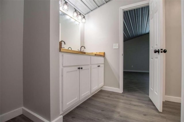 2125 Mccollum Church Rd, Lineville, AL 36266 - bathroom featuring baseboards, vanity, and wood finished floors