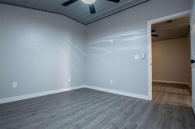 2125 Mccollum Church Rd, Lineville, AL 36266 - spare room featuring dark wood-style flooring, a ceiling fan, baseboards, and vaulted ceiling