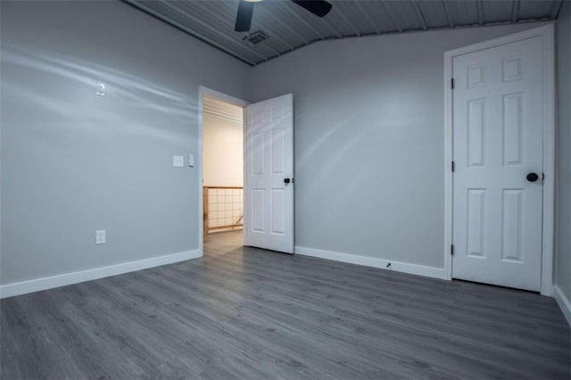 2125 Mccollum Church Rd, Lineville, AL 36266 - unfurnished room featuring dark wood-type flooring, baseboards, and a ceiling fan