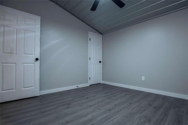 2125 Mccollum Church Rd, Lineville, AL 36266 - spare room with vaulted ceiling, dark wood-type flooring, ceiling fan, and baseboards